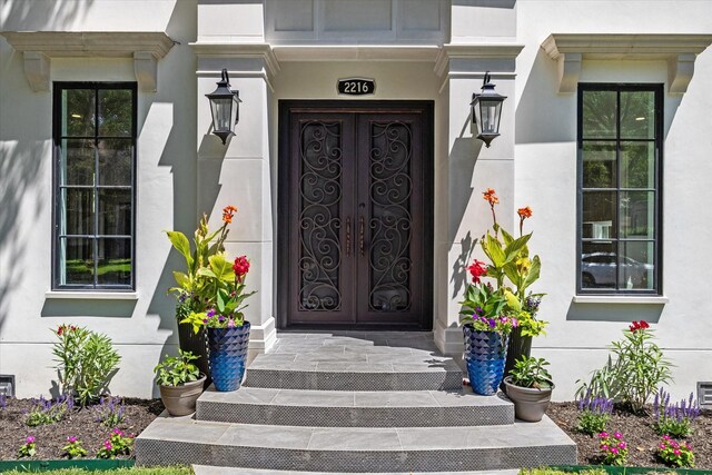 2216 Tangley St, Houston, TX 77005 - property entrance with stucco siding and french doors
