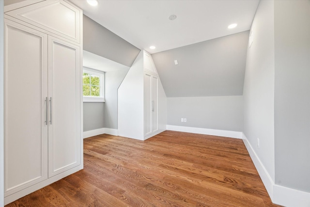 2216 Tangley St, Houston, TX 77005 - bonus room with baseboards, vaulted ceiling, wood finished floors, and recessed lighting