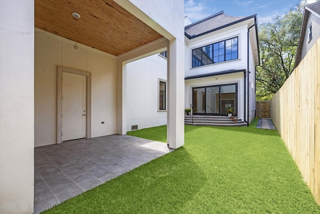 2216 Tangley St, Houston, TX 77005 - back of property with stucco siding, a patio area, and roof with shingles