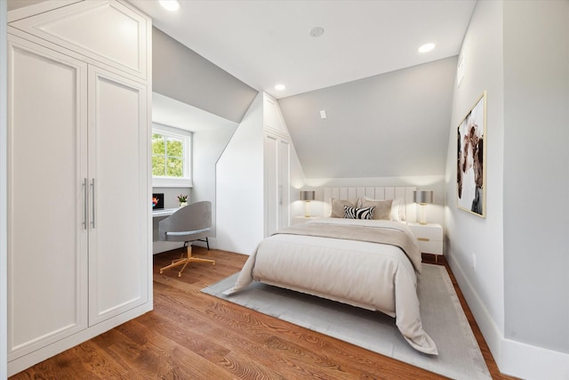 2216 Tangley St, Houston, TX 77005 - bedroom featuring vaulted ceiling, wood finished floors, and recessed lighting