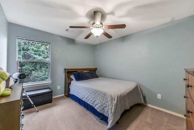 1703 Balsam Spruce Cir, Conroe, TX 77301 - carpeted bedroom featuring baseboards and ceiling fan