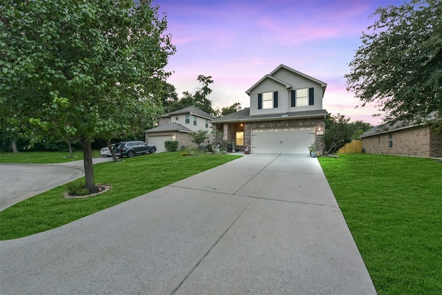 1703 Balsam Spruce Cir, Conroe, TX 77301 - traditional-style home featuring concrete driveway, an attached garage, a yard, and stone siding