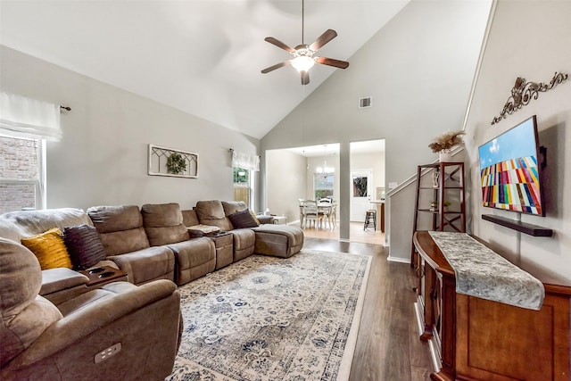 1703 Balsam Spruce Cir, Conroe, TX 77301 - living area with high vaulted ceiling, a ceiling fan, dark wood-style floors, a chandelier, and baseboards