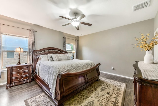 1703 Balsam Spruce Cir, Conroe, TX 77301 - bedroom featuring dark wood-type flooring, baseboards, and ceiling fan