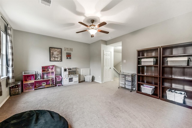 1703 Balsam Spruce Cir, Conroe, TX 77301 - rec room with carpet floors, ceiling fan, baseboards, and plenty of natural light