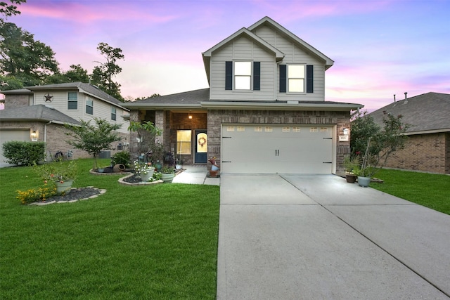 1703 Balsam Spruce Cir, Conroe, TX 77301 - traditional-style house with concrete driveway, a front yard, a garage, and stone siding