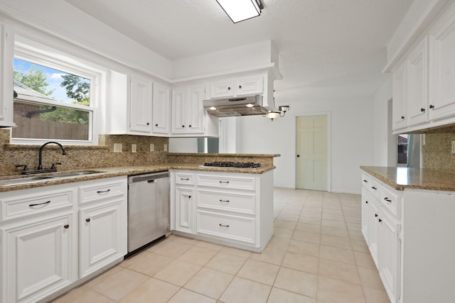 31111 Alice Ln, Tomball, TX 77375 - kitchen with stainless steel appliances, a sink, tasteful backsplash, and white cabinets