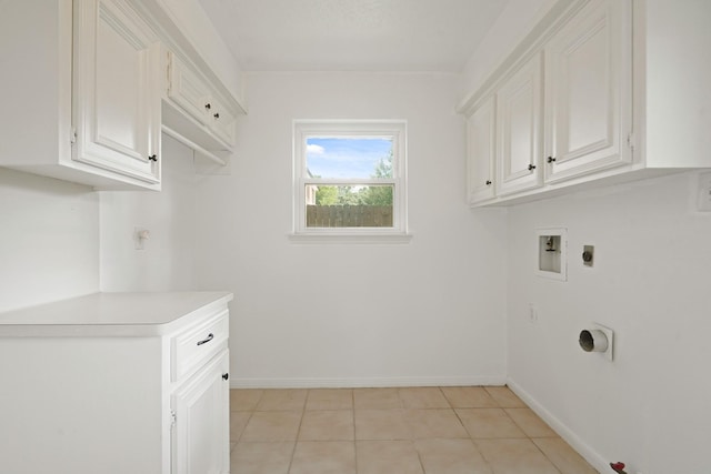 31111 Alice Ln, Tomball, TX 77375 - washroom featuring hookup for an electric dryer, gas dryer hookup, baseboards, hookup for a washing machine, and light tile patterned floors