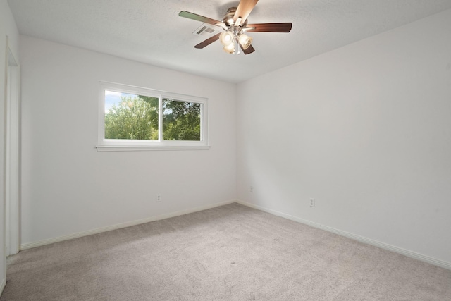 31111 Alice Ln, Tomball, TX 77375 - unfurnished room featuring light carpet, ceiling fan, and baseboards