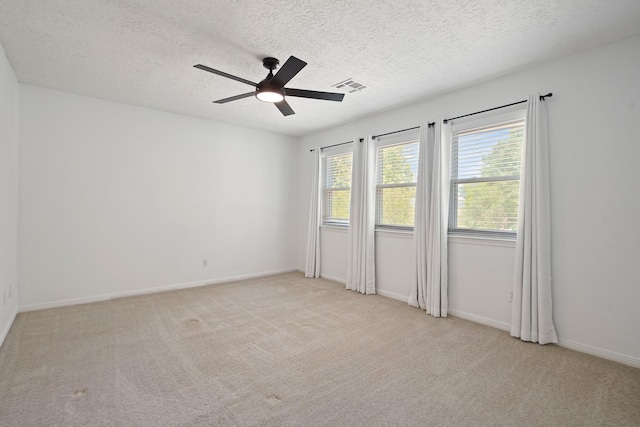 31111 Alice Ln, Tomball, TX 77375 - unfurnished room featuring ceiling fan, a textured ceiling, carpet, and baseboards