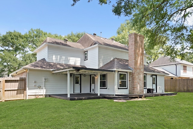 31111 Alice Ln, Tomball, TX 77375 - back of property with roof with shingles and a chimney