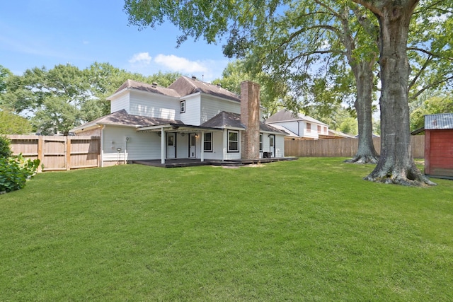 31111 Alice Ln, Tomball, TX 77375 - back of property featuring a shingled roof and a chimney