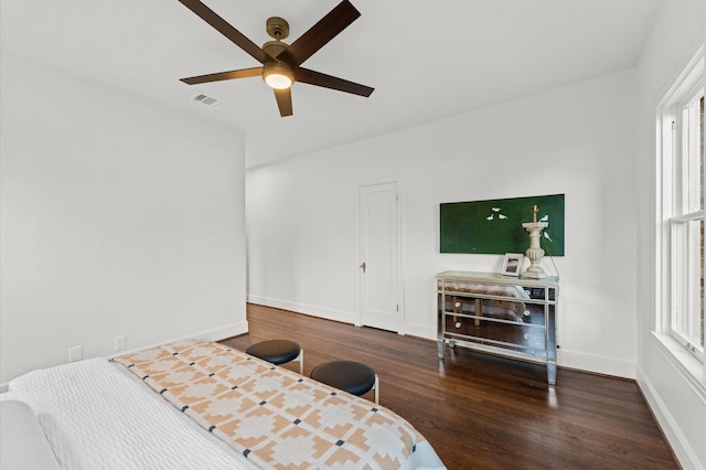 304 Bayland Ave, Houston, TX 77009 - bedroom featuring wood finished floors, baseboards, and multiple windows