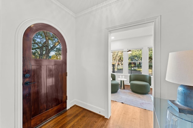 304 Bayland Ave, Houston, TX 77009 - foyer entrance with wood finished floors, healthy amount of natural light, baseboards, and crown molding