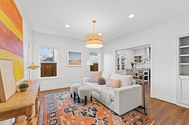304 Bayland Ave, Houston, TX 77009 - living area with dark wood-style flooring, recessed lighting, and baseboards