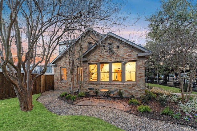 304 Bayland Ave, Houston, TX 77009 - view of front of home featuring brick siding and a patio area