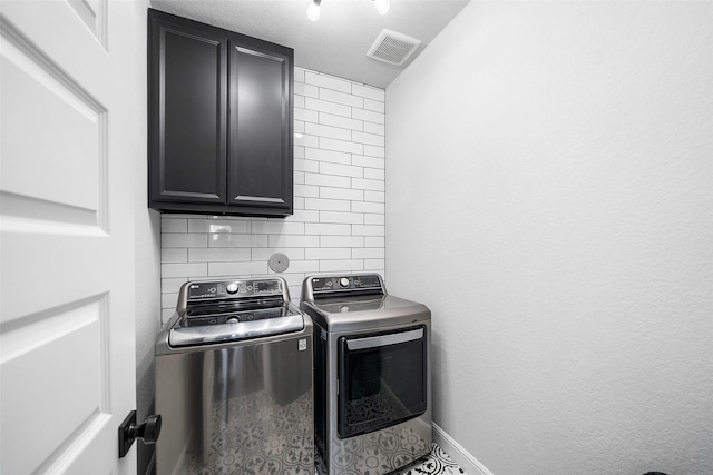 15838 Weston Ridge Dr, Humble, TX 77346 - washroom featuring cabinet space, washer and dryer, and baseboards