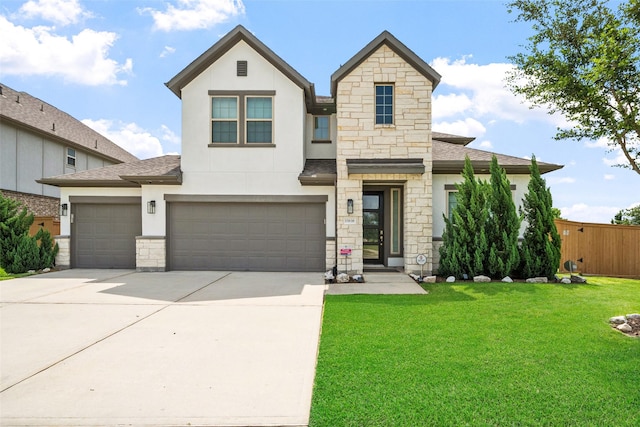 15838 Weston Ridge Dr, Humble, TX 77346 - view of front of home with stone siding, roof with shingles, driveway, and stucco siding