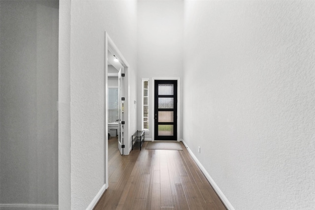 15838 Weston Ridge Dr, Humble, TX 77346 - entryway with dark wood-style flooring, baseboards, and a towering ceiling