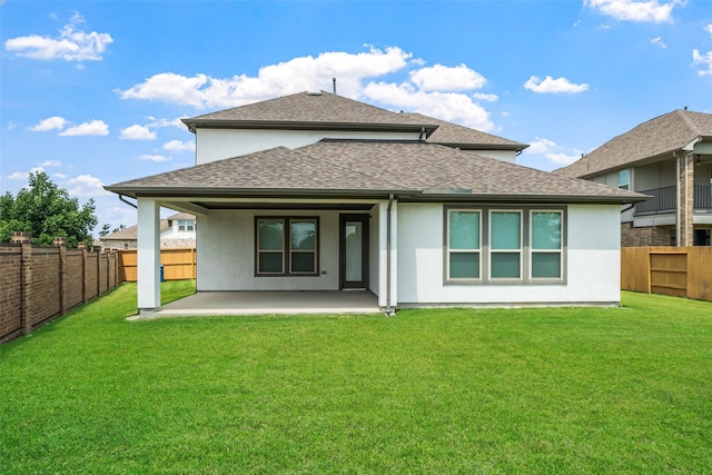 15838 Weston Ridge Dr, Humble, TX 77346 - back of property with stucco siding, a shingled roof, and a patio