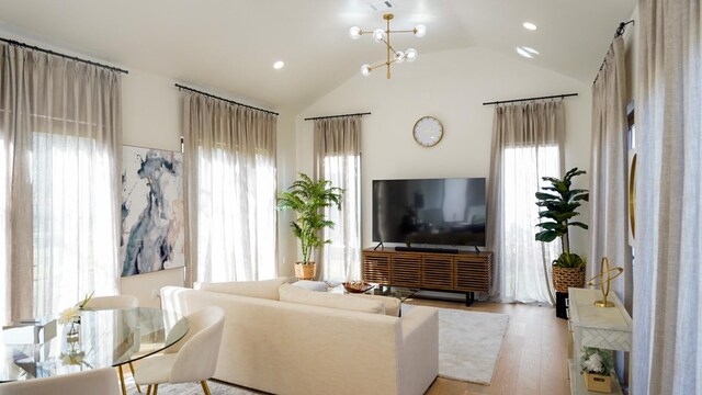 7519 Red Bay Cir, Magnolia, TX 77354 - living room with lofted ceiling, light wood finished floors, and recessed lighting