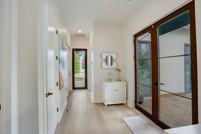 7519 Red Bay Cir, Magnolia, TX 77354 - entryway featuring light wood-style flooring, baseboards, recessed lighting, and french doors