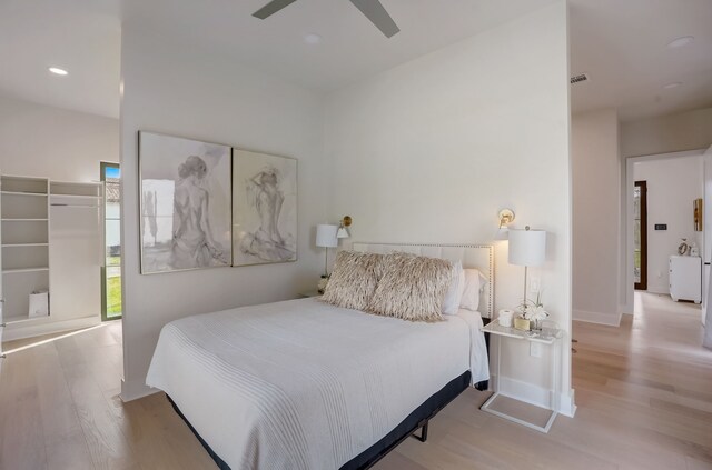 7519 Red Bay Cir, Magnolia, TX 77354 - bedroom with wood finished floors, a ceiling fan, and recessed lighting