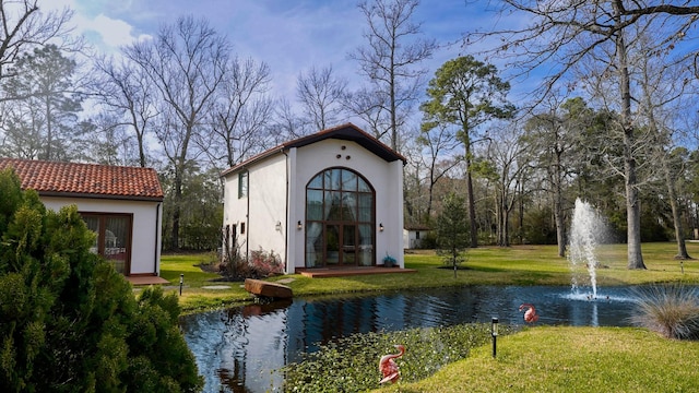 7519 Red Bay Cir, Magnolia, TX 77354 - view of outdoor structure featuring french doors and a water view