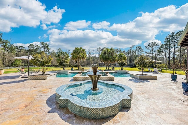 7519 Red Bay Cir, Magnolia, TX 77354 - view of home's community featuring a swimming pool, a patio area, view of wooded area, and a jacuzzi