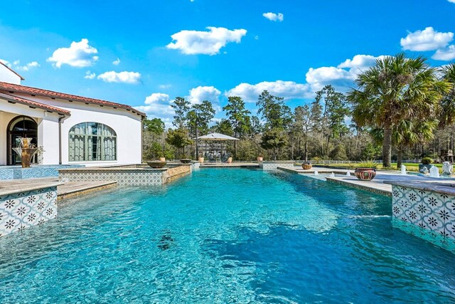 7519 Red Bay Cir, Magnolia, TX 77354 - swimming pool featuring a patio
