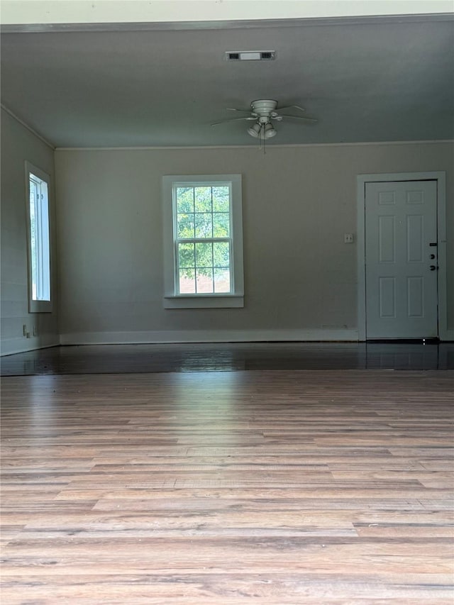 111 Conroe Dr, Conroe, TX 77301 - spare room with wood finished floors, ceiling fan, and baseboards