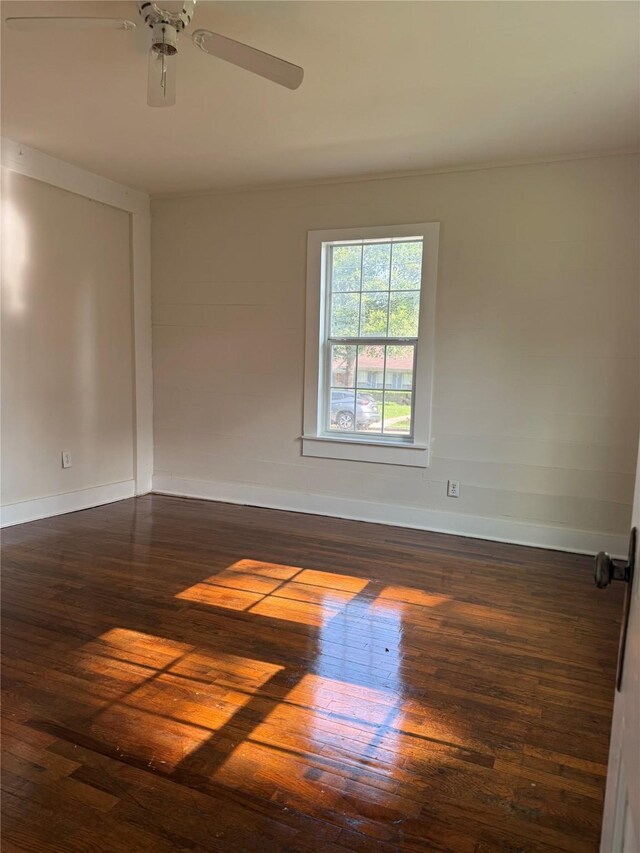 111 Conroe Dr, Conroe, TX 77301 - unfurnished room with hardwood / wood-style floors, baseboards, and a ceiling fan