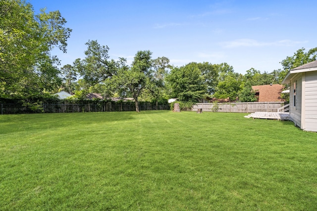 111 Conroe Dr, Conroe, TX 77301 - view of yard featuring a deck