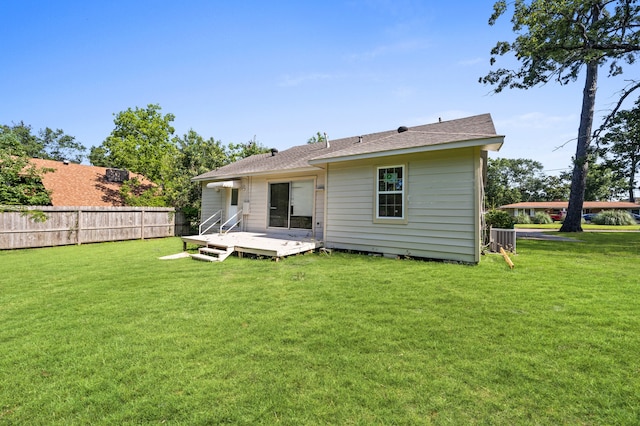 111 Conroe Dr, Conroe, TX 77301 - rear view of property with a deck and cooling unit