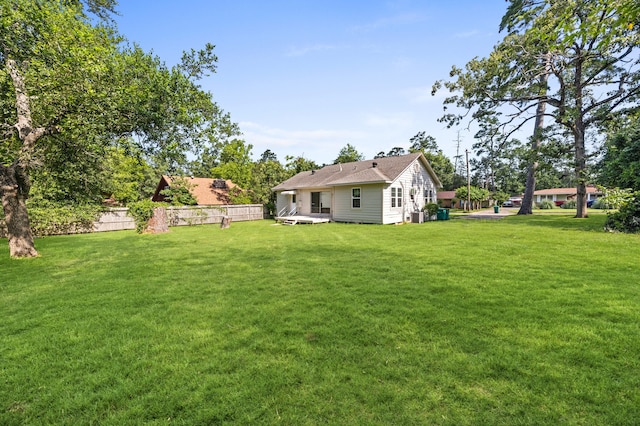 111 Conroe Dr, Conroe, TX 77301 - view of yard with central air condition unit and a wooden deck