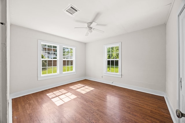 111 Conroe Dr, Conroe, TX 77301 - empty room featuring ceiling fan, wood finished floors, and baseboards