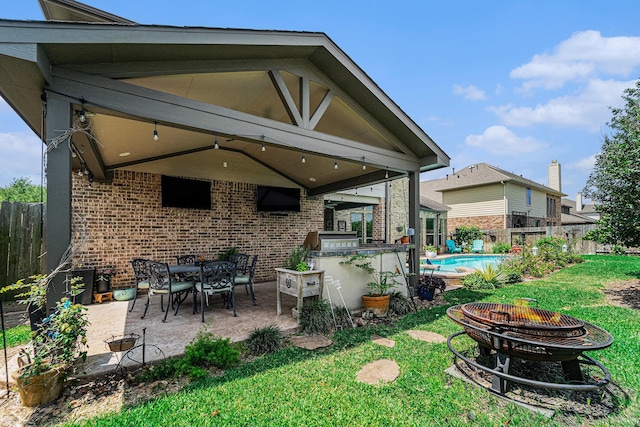 21806 W Firemist Ct, Cypress, TX 77433 - view of patio / terrace with an outdoor fire pit and a grill