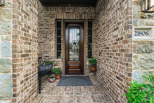 21806 W Firemist Ct, Cypress, TX 77433 - view of exterior entry with brick siding