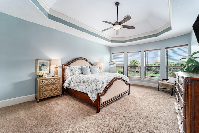 21806 W Firemist Ct, Cypress, TX 77433 - bedroom featuring a raised ceiling, ornamental molding, baseboards, light carpet, and a ceiling fan