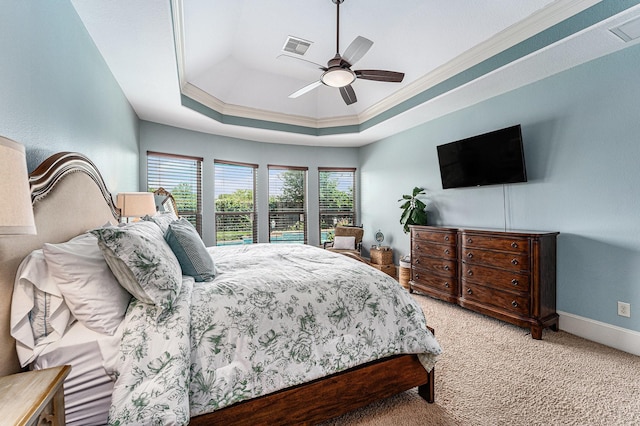 21806 W Firemist Ct, Cypress, TX 77433 - bedroom featuring carpet, ornamental molding, a tray ceiling, baseboards, and ceiling fan