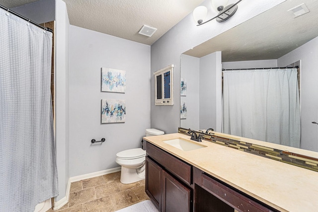 21806 W Firemist Ct, Cypress, TX 77433 - full bath featuring toilet, baseboards, vanity, stone tile flooring, and a shower with curtain