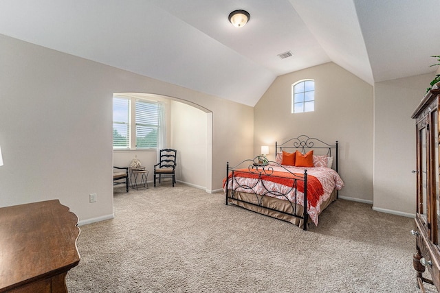 21806 W Firemist Ct, Cypress, TX 77433 - bedroom with lofted ceiling, carpet floors, baseboards, and arched walkways