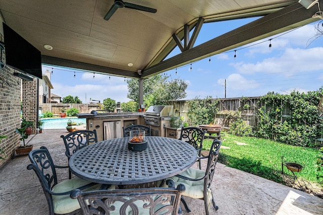 21806 W Firemist Ct, Cypress, TX 77433 - fenced backyard with outdoor dining area, a patio, and ceiling fan