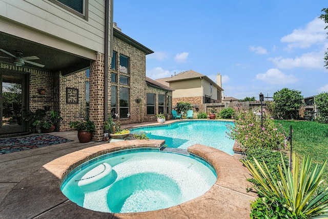 21806 W Firemist Ct, Cypress, TX 77433 - view of pool featuring ceiling fan, a pool with connected hot tub, a fenced backyard, and a patio