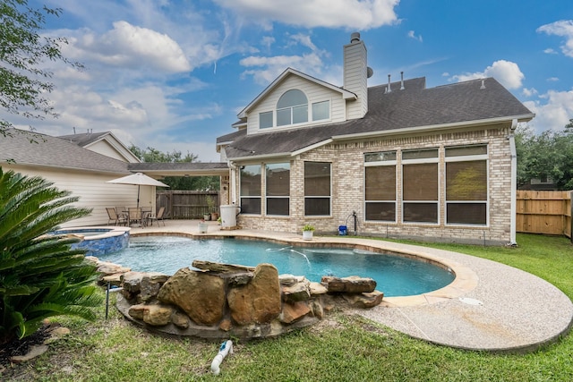 11510 Maple Falls Dr, Tomball, TX 77377 - back of property with brick siding, a fenced backyard, a patio area, roof with shingles, and a pool with connected hot tub