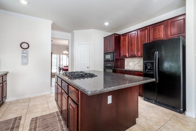 11510 Maple Falls Dr, Tomball, TX 77377 - kitchen with black appliances, dark brown cabinets, a chandelier, light tile patterned floors, and crown molding