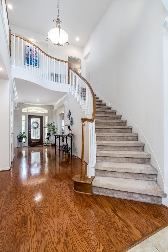11510 Maple Falls Dr, Tomball, TX 77377 - entryway with a towering ceiling, stairs, wood finished floors, baseboards, and recessed lighting