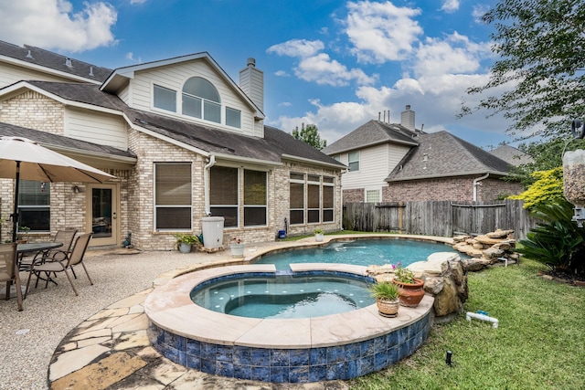 11510 Maple Falls Dr, Tomball, TX 77377 - view of pool featuring a fenced backyard, a patio, and a pool with connected hot tub