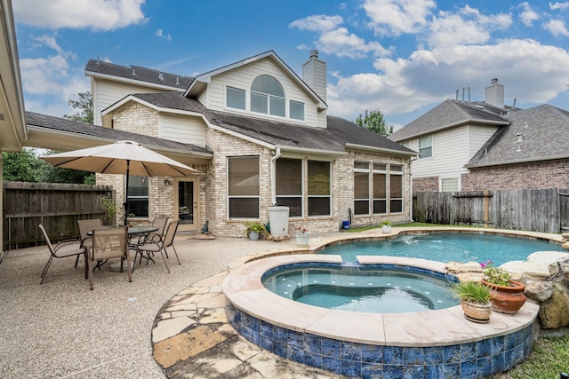 11510 Maple Falls Dr, Tomball, TX 77377 - view of pool featuring a fenced backyard, a patio, and a pool with connected hot tub