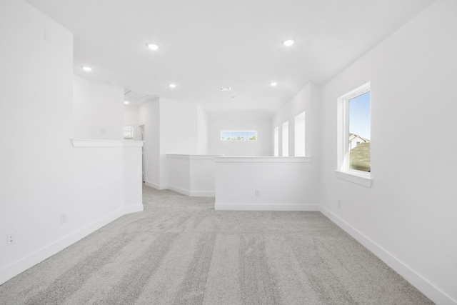 1106 Kinsey Wilderness Ln, Conroe, TX 77301 - spare room with light colored carpet, recessed lighting, and baseboards